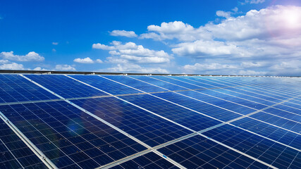 Solar cell panels installed on the roof top of a house become dirty caused by birds poops, with white clouds ,blue sky and the sunlight, to provide power to the house, to go green energy concept