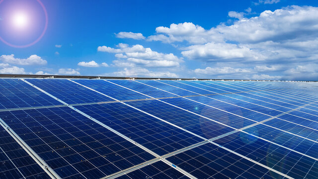 Solar cell panels installed on the roof top of a house become dirty caused by birds poops, with white clouds ,blue sky and the sunlight, to provide power to the house, to go green energy concept