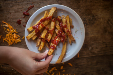 person holding a plate of chips