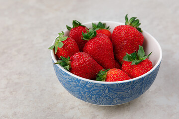 plate with strawberries on the kitchen table