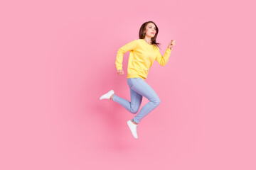 Fototapeta na wymiar Full length body size photo girl running fast on sale jumping up smiling isolated pastel pink color background