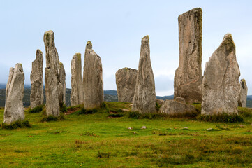 The Callanish Stones are an arrangement of standing stones placed in a cruciform pattern with a...