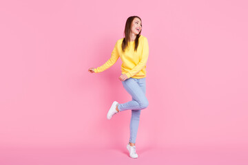 Fototapeta na wymiar Full length body size view of attractive cheerful girl dancing having fun free time isolated over pastel pink color background