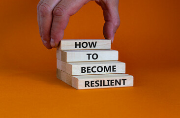 How to become resilient symbol. Concept words 'How to become resilient' on wooden blocks on a beautiful orange background. Businessman hand. Business, How to become resilient concept.