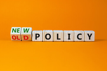 New or old policy symbol. Turned wooden cubes, changed words 'old policy' to 'new policy'....