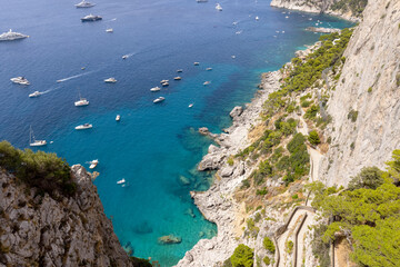 Fototapeta premium Rocky shoreline on the Tyrrhenian Sea nearby Marina Piccola, view of the footpath Via Krupp, Capri Island, Italy