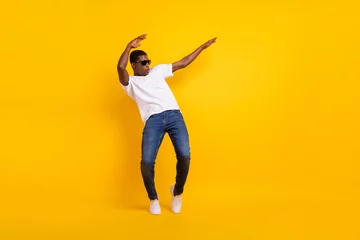 Abwaschbare Fototapete Full length body size view of attractive cheerful guy dancing pout lips having fun isolated over bright yellow color background © deagreez