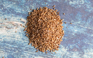 Pile of Barley Wheat on a Rustic Blue Table