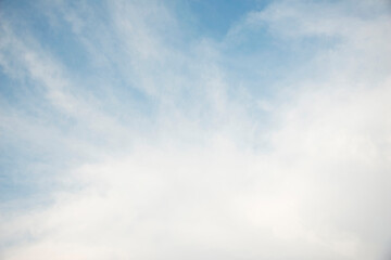 Scattered cloud clusters in a blue sky, blue sky background with white clouds,