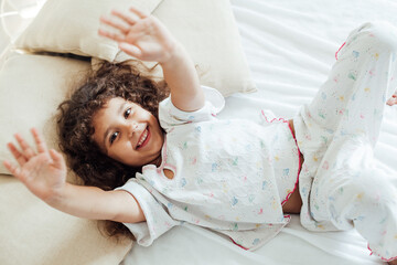 Little girl doesn't want to sleep in bed