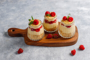 Homemade raspberry trifles on a light background.