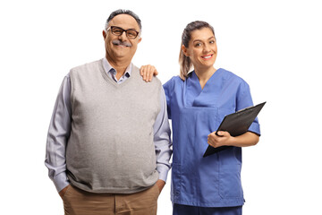 Female health care worker and a mature male patient smiling at camera