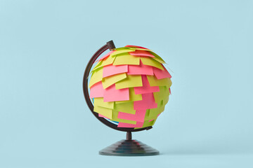 Earth globe with colored paper stickers
