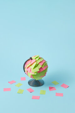 Colored sticky paper stickers on globe
