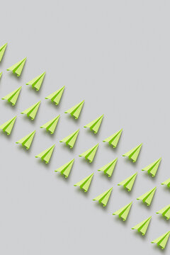 Green paperplanes in rows