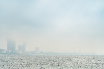 Morning haze over the bay in Limassol, Cyprus. Fog cover the coastline and buildings