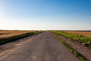 Fototapeta na wymiar The road among Russian fields
