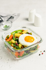 Clean eating, healthy diet, egg vegetables in glass container. Space for text.