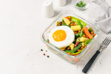 Healthy eating, meal prep, egg spring vegetables in glass container. Space for text.