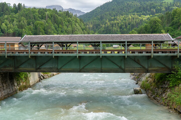 Railway bridge over the river Partnach in Garmisch-Partenkirchen in Bavaria - obrazy, fototapety, plakaty