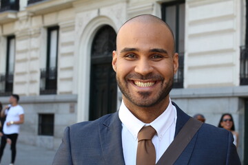 Wealthy ethnic entrepreneur walking outdoors