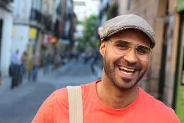 Young man with eyeglasses and beret outdoors