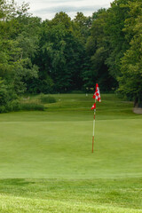 Obraz premium golf course on a sunny day looking at the golf holes