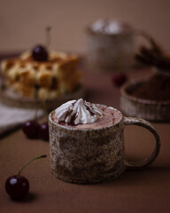 Hot chocolate and brownies on a beige background