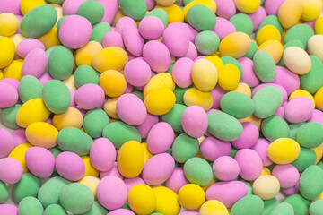 Group of colorful peanuts in glaze.
