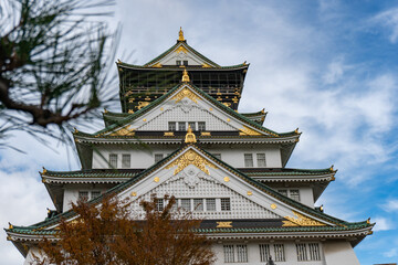 Osaka Castle in Osaka with autumn leaves. Japan.