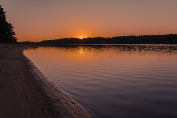 Beautiful sunset over the river. Scandinavian nature. Finland