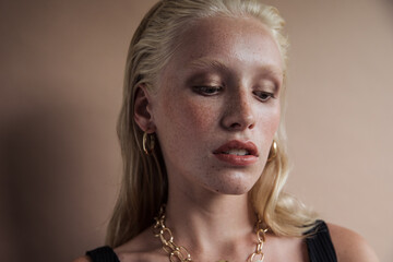 Young model wearing earrings and necklace