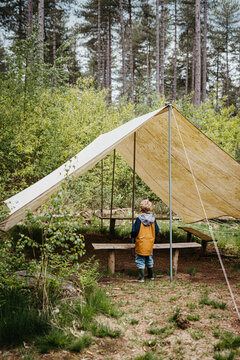 Boy checking out camp area