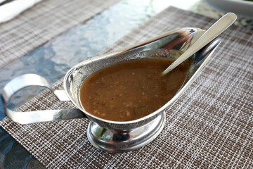 Tkemali sauce in gravy boat