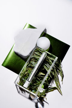Artistic still life cannabis set with joint and marijuana leaf 