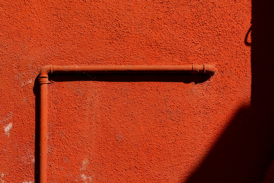 Water pipes on a colored wall