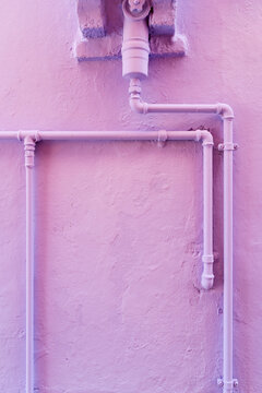 Water pipes on a colored wall