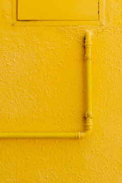 Water pipes on a colored wall