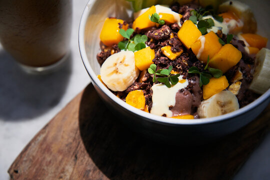 Healthy exotic fruit and frozen cacao breakfast bowl
