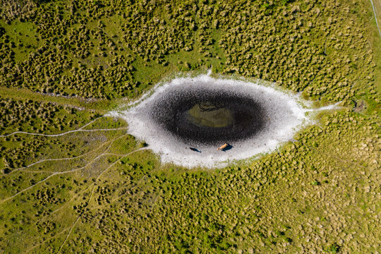Aerial View of a dried up pond with cattle 