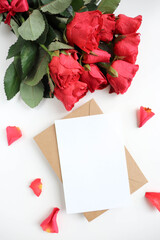 greeting card design. large bouquet of red roses on a white background and blank for text 