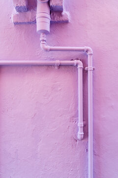Water pipes on a colored wall