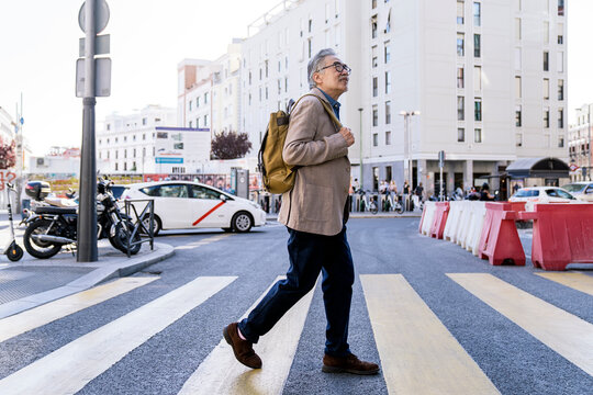Asian Man Walking in the City