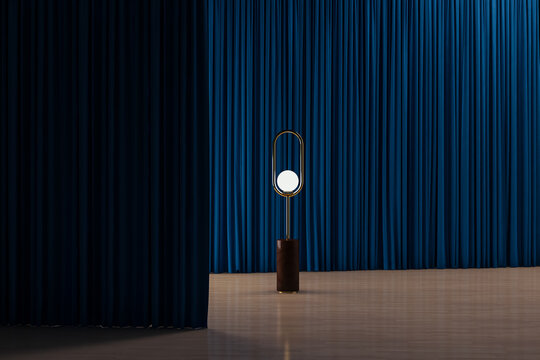 Isolated lamp in an interior between curtains
