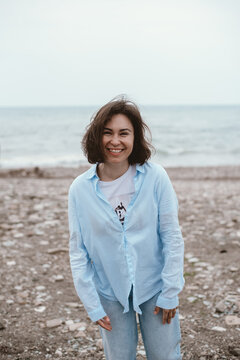 Happy woman at the off-season beach