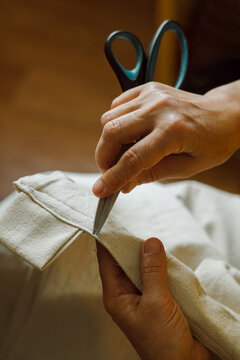 Elderly woman's hands with scissors