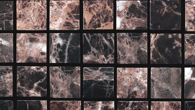 Video background and texture of brown marble mosaic. 