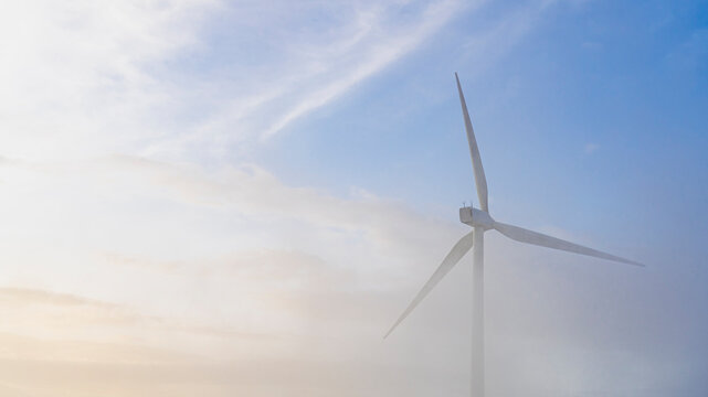 Windmill over a beautiful sunset sky
