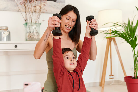 Mom vlogging weights workout with her son - Powered by Adobe
