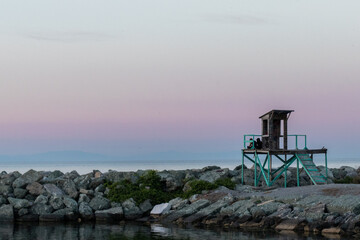 Fototapeta na wymiar lighthouse at sunset in greece